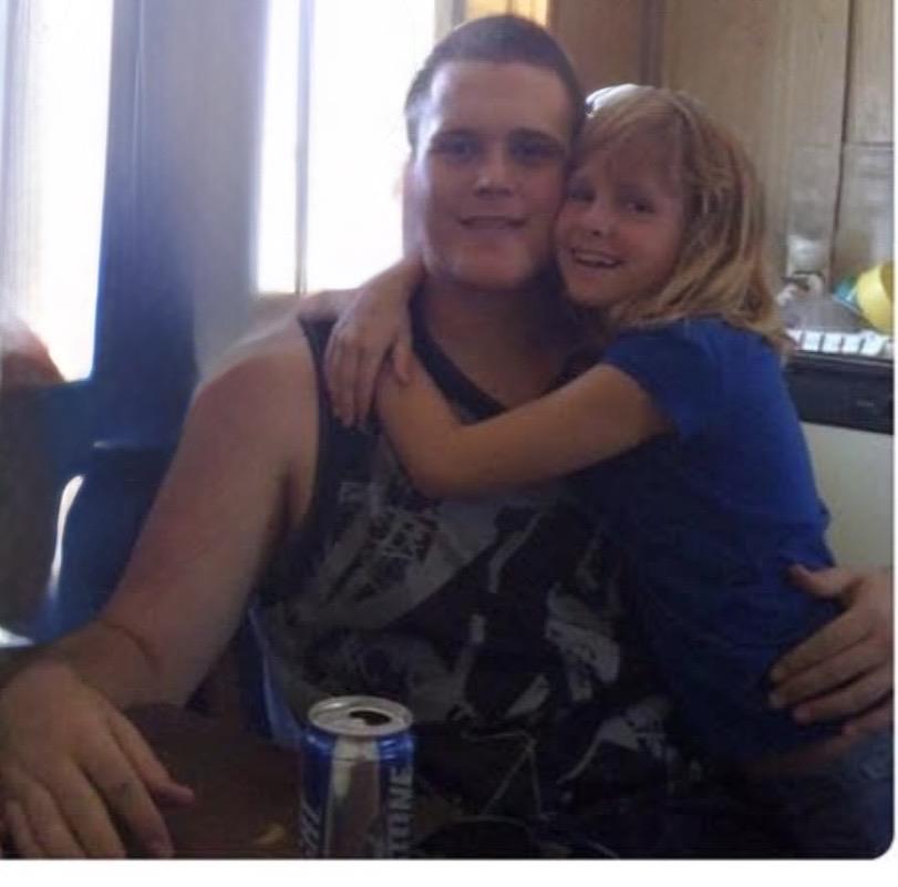 A man and a girl posing for a picture