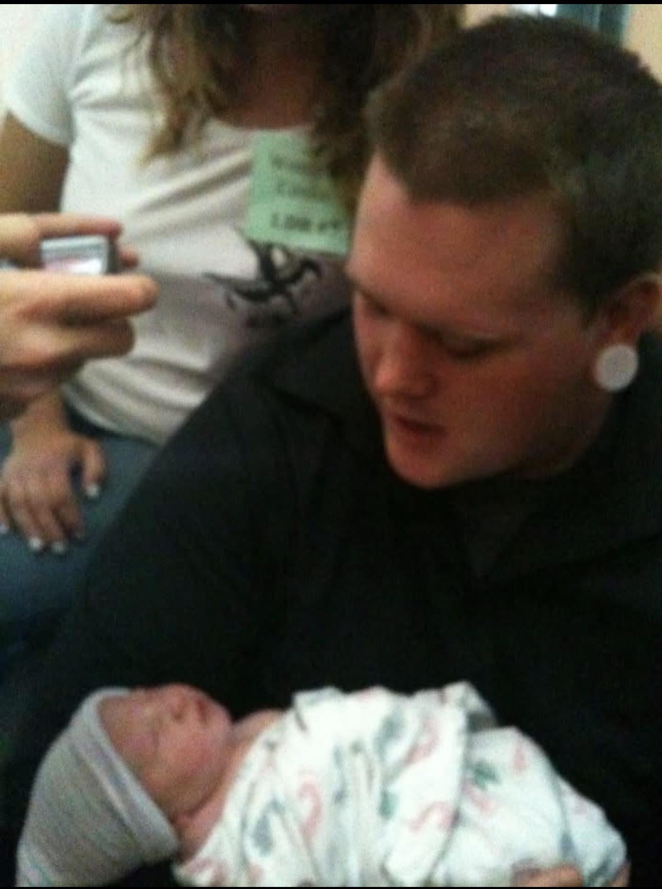 A woman holding a baby