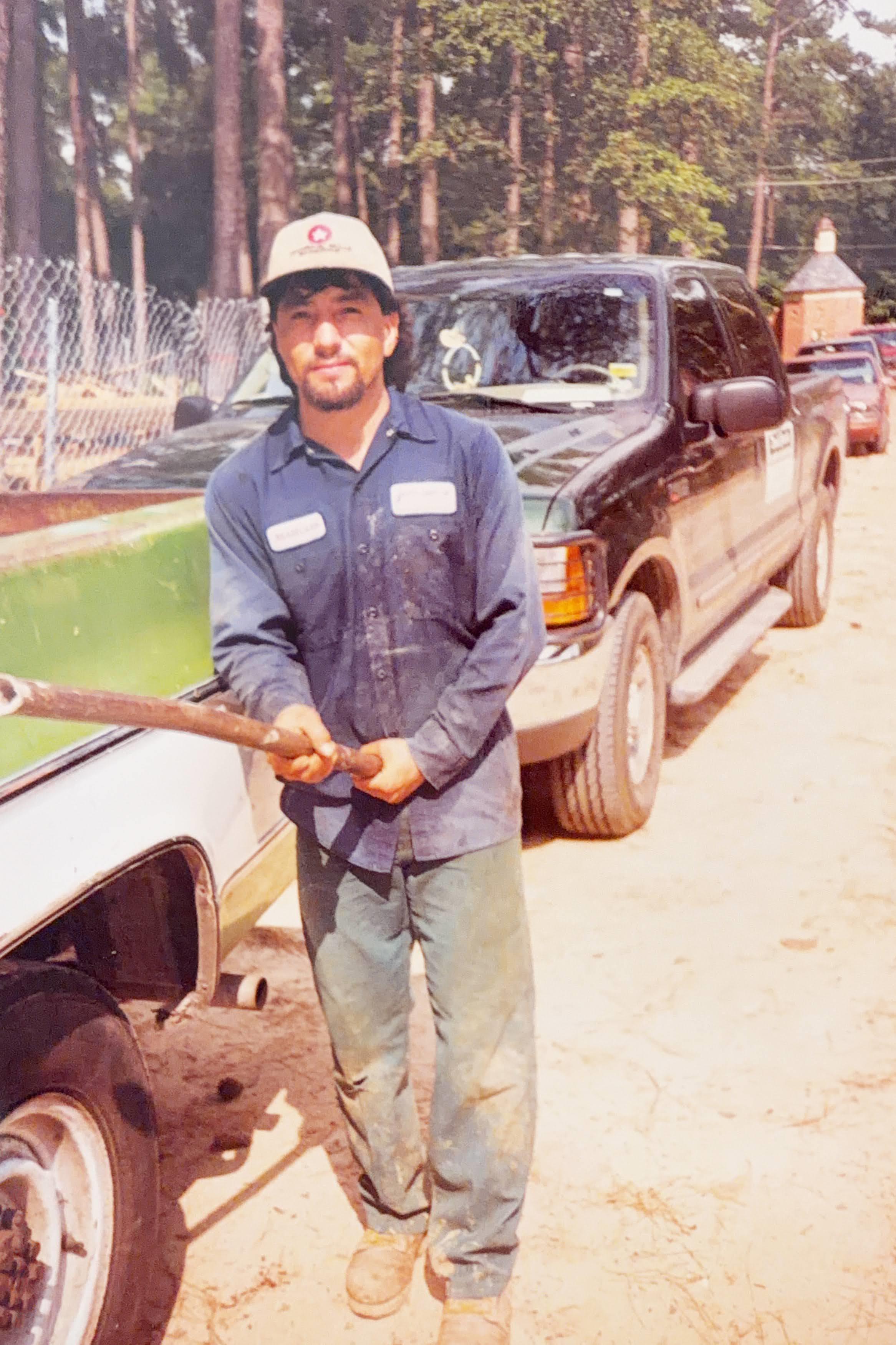 A man holding a hose