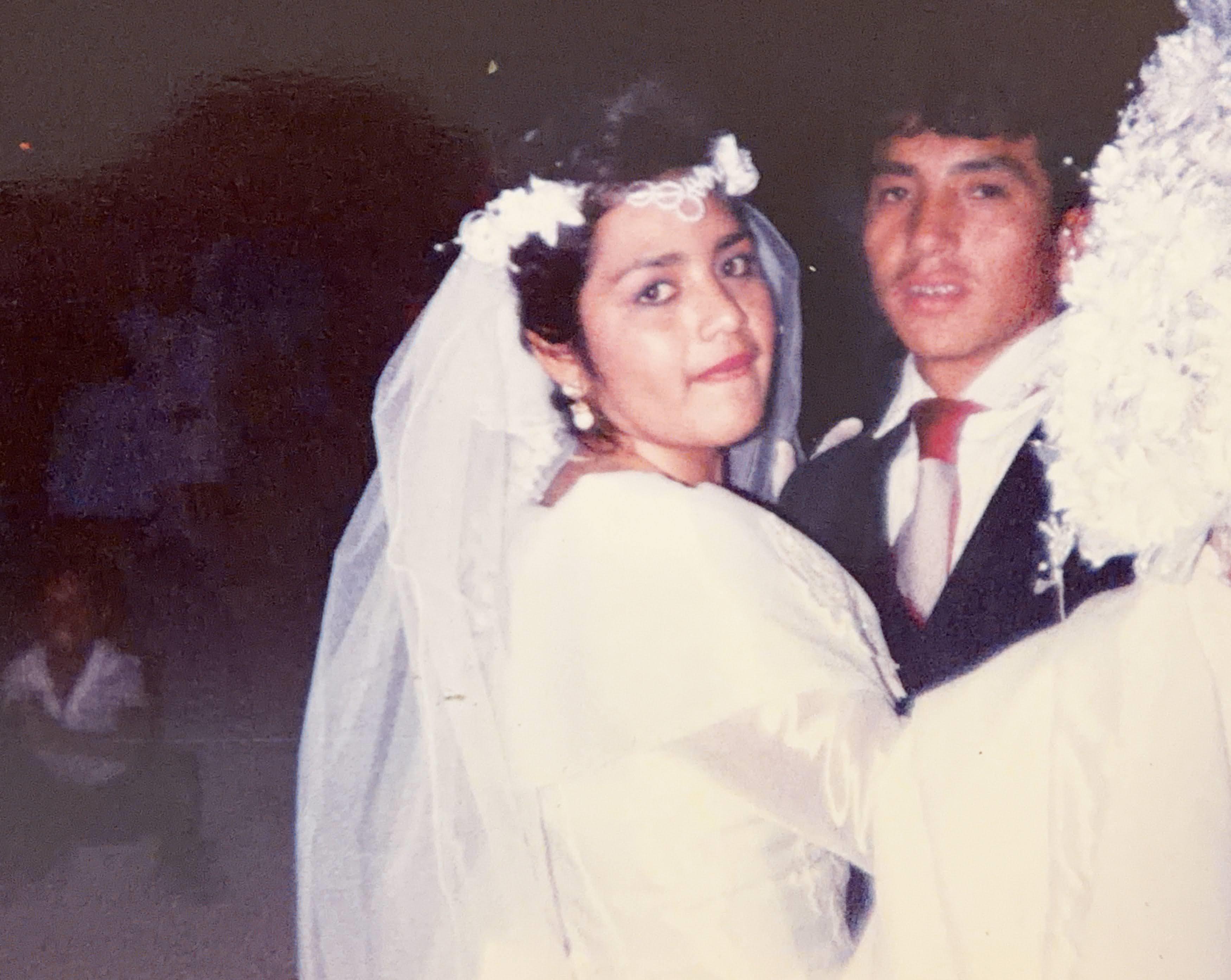 A man and woman in wedding attire
