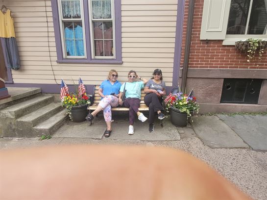 A group of women sitting on a bench