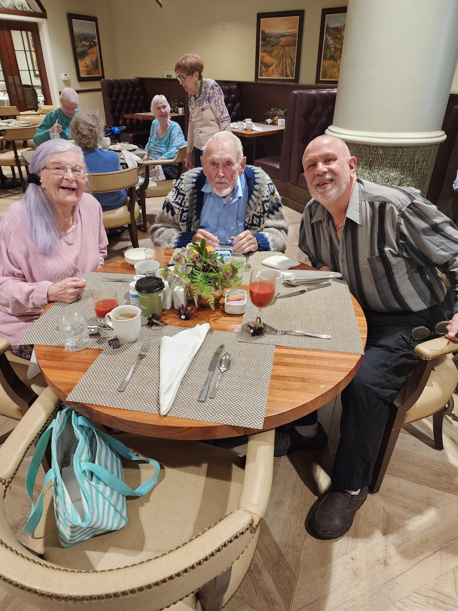 A group of people sitting at a table
