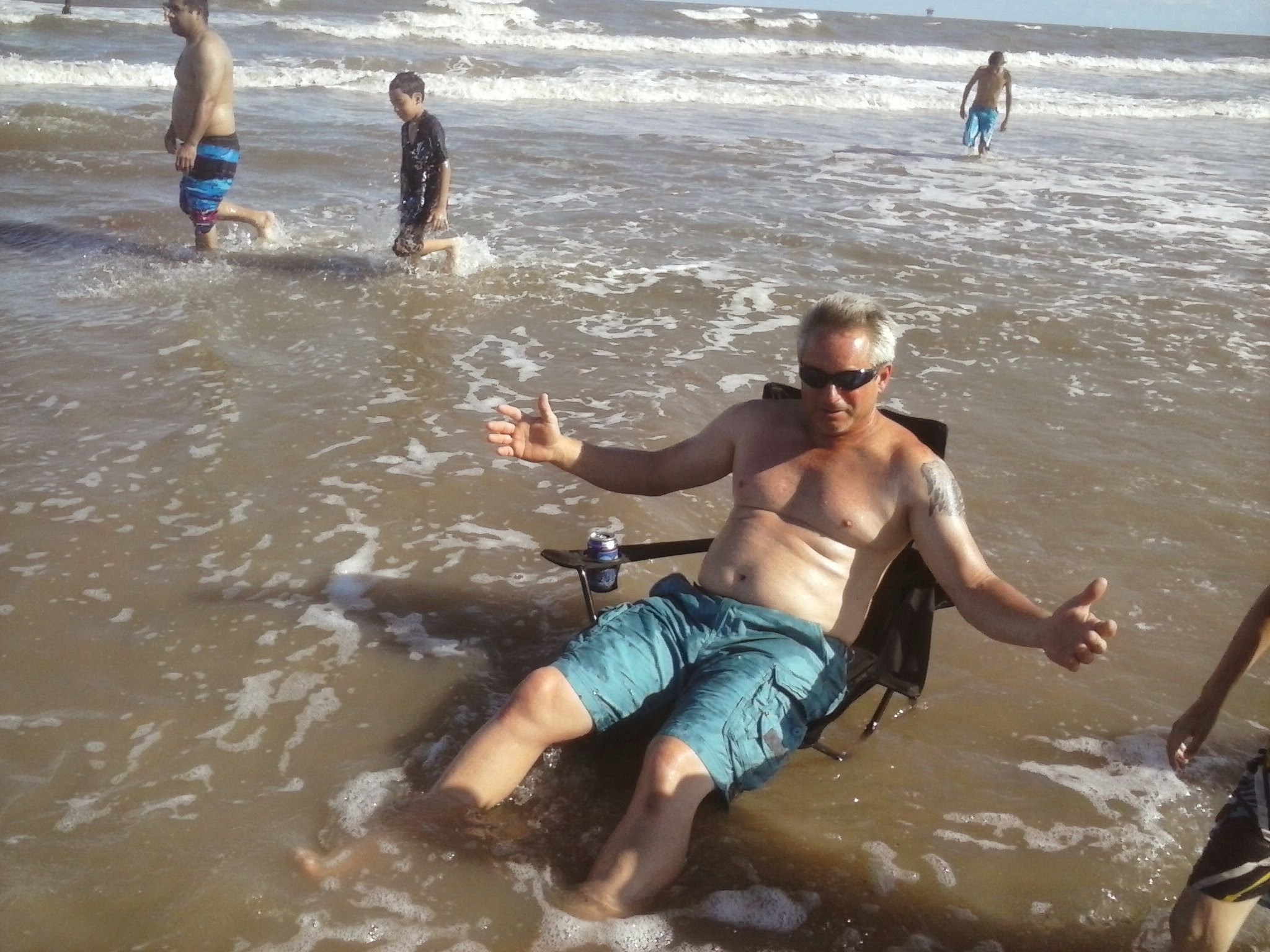 A man sitting in a chair in the water