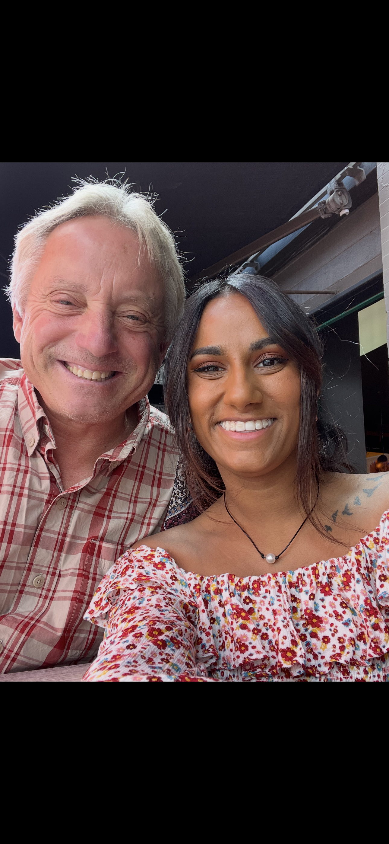 A man and woman taking a selfie