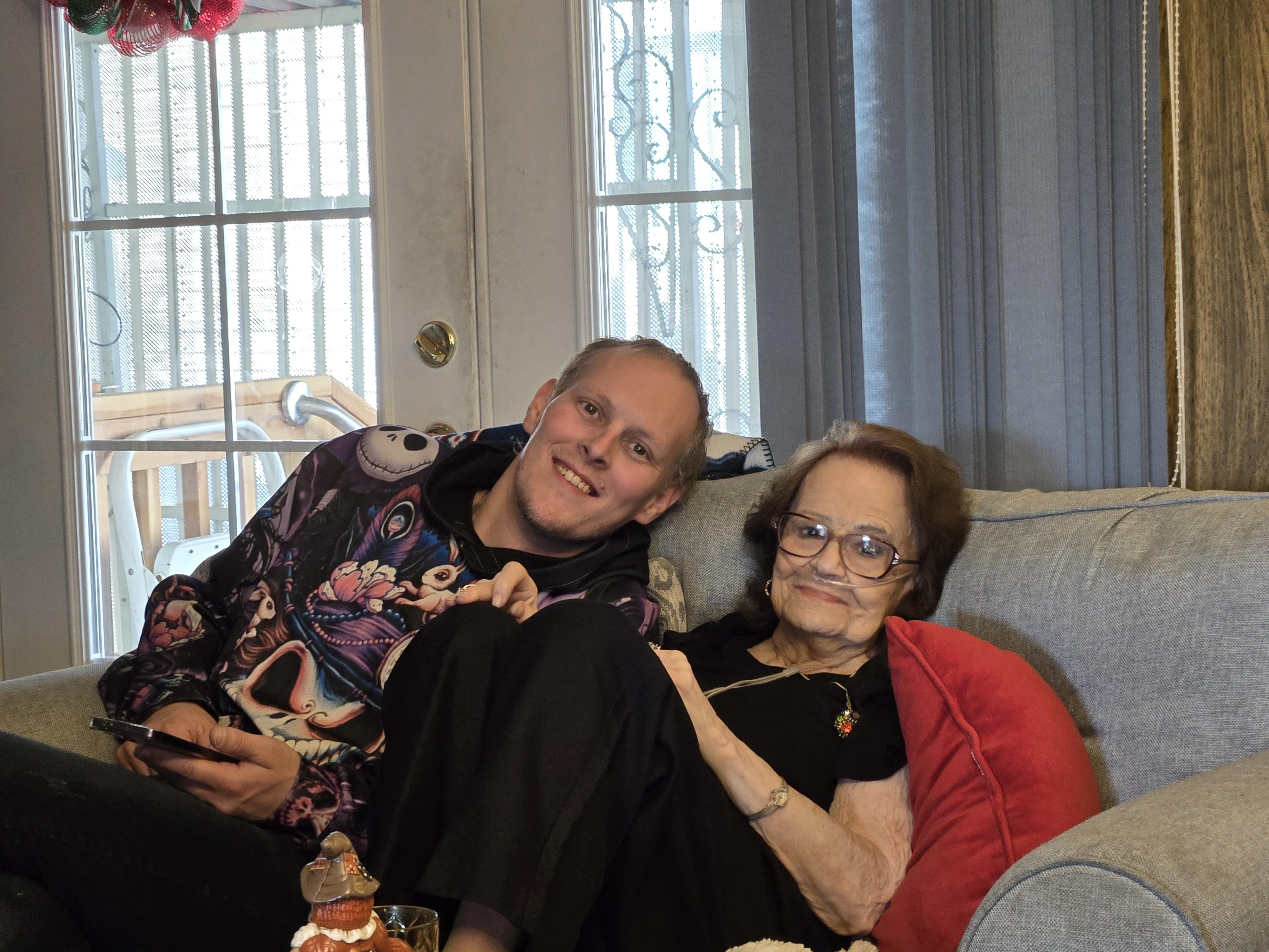 A man and woman sitting on a couch