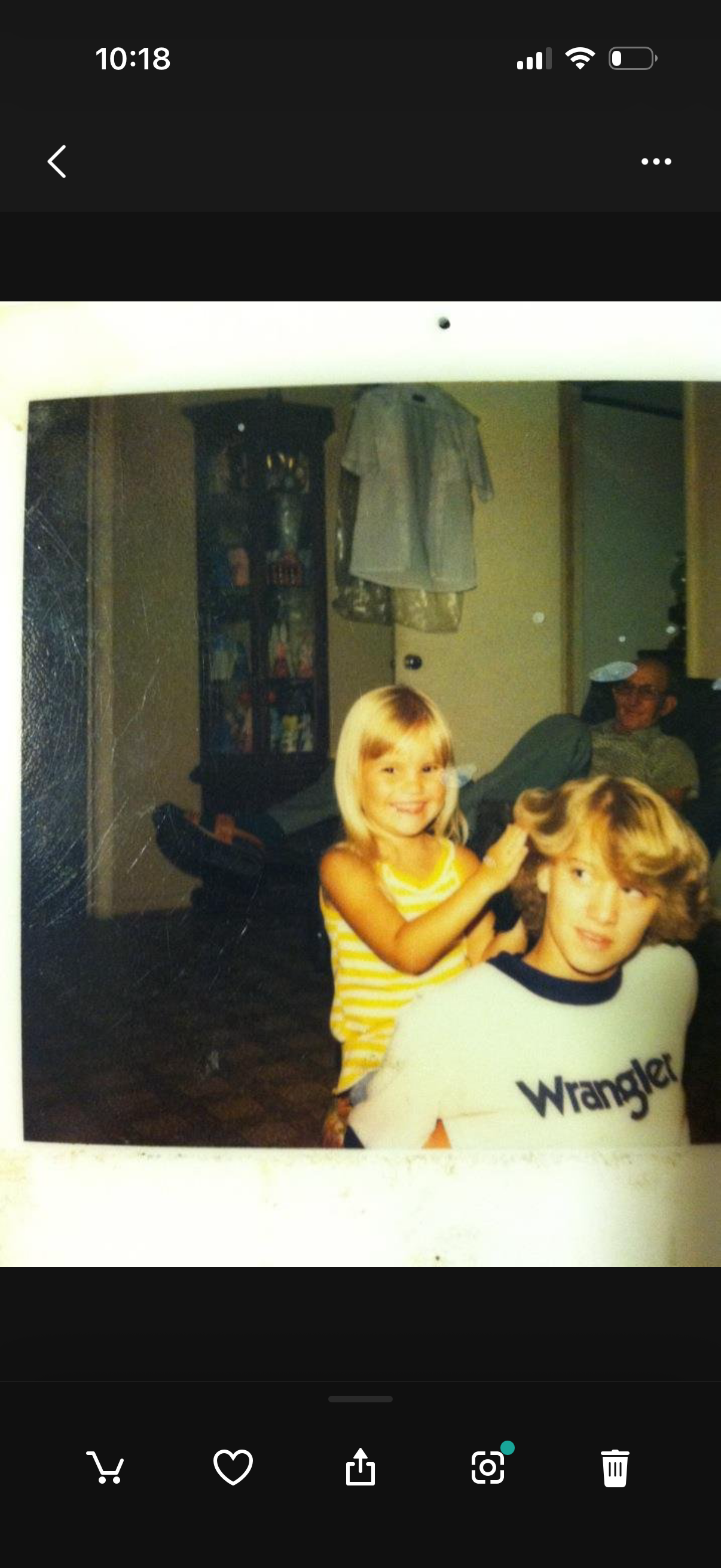 A girl combing a man's hair