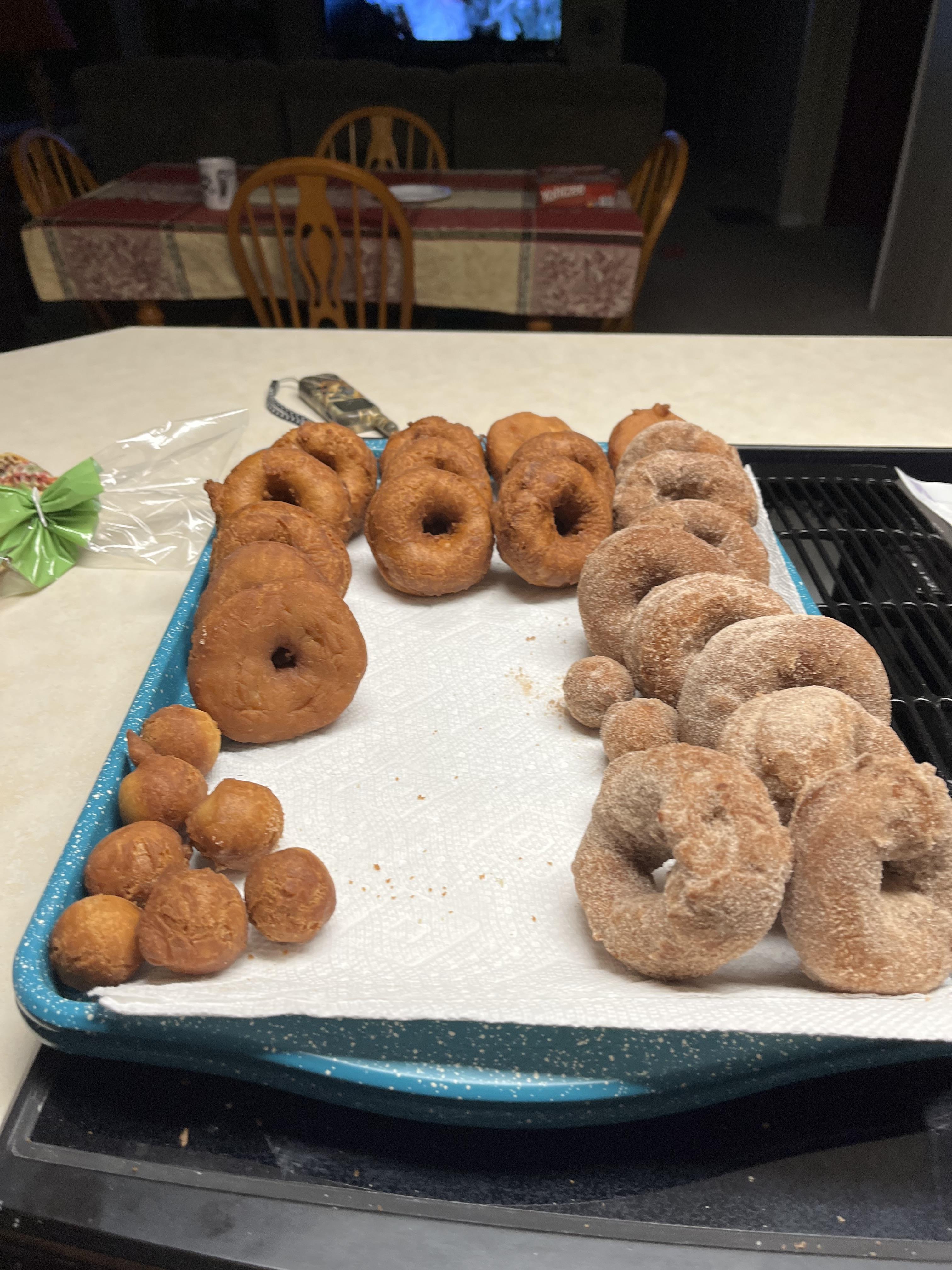A tray of donuts on a table