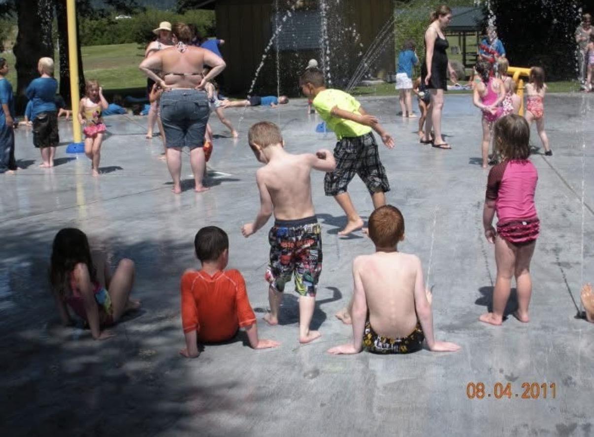 A group of children playing in a water park