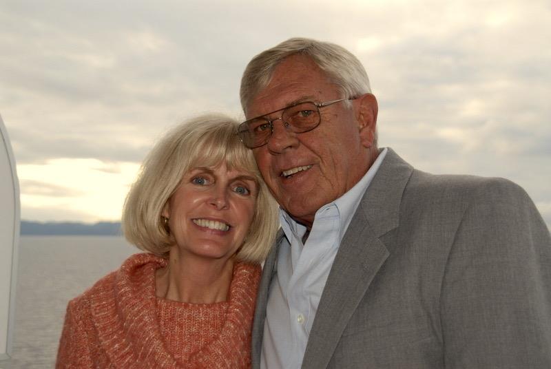 A man and woman posing for a picture