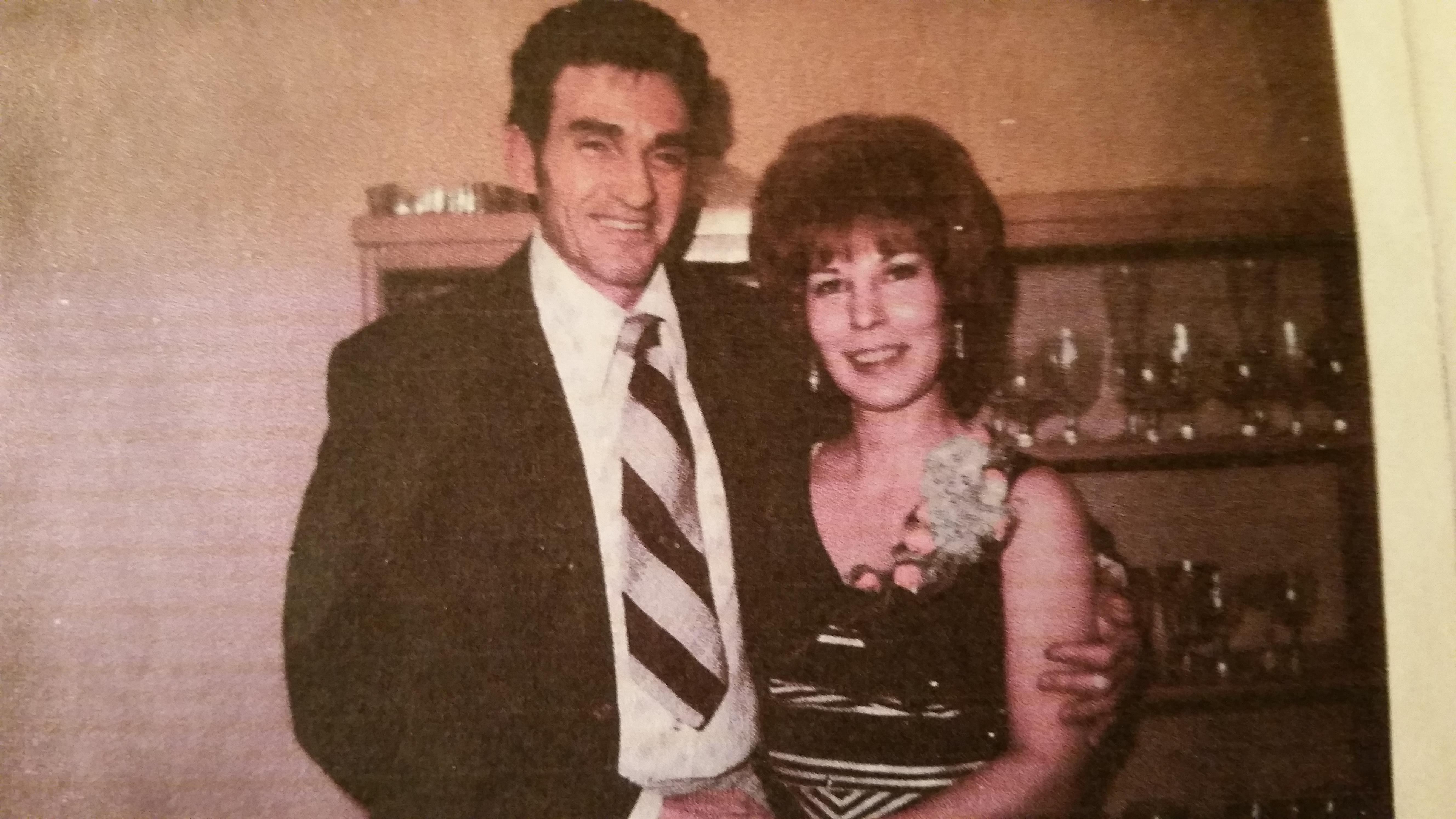 A man and woman posing for a picture