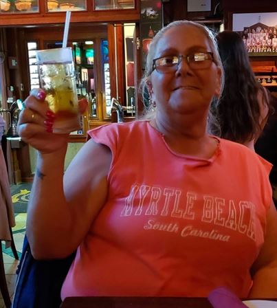 A woman holding a drink