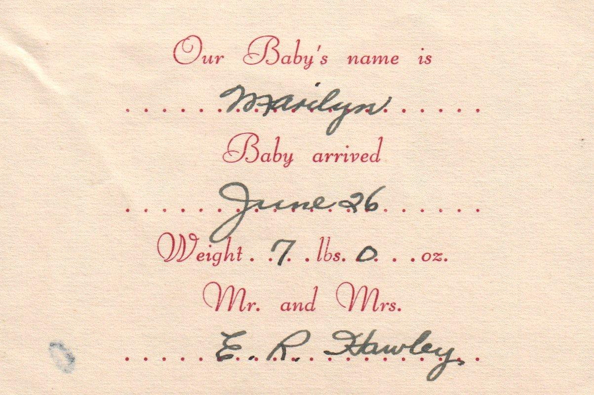 A close-up of a baby arrival card