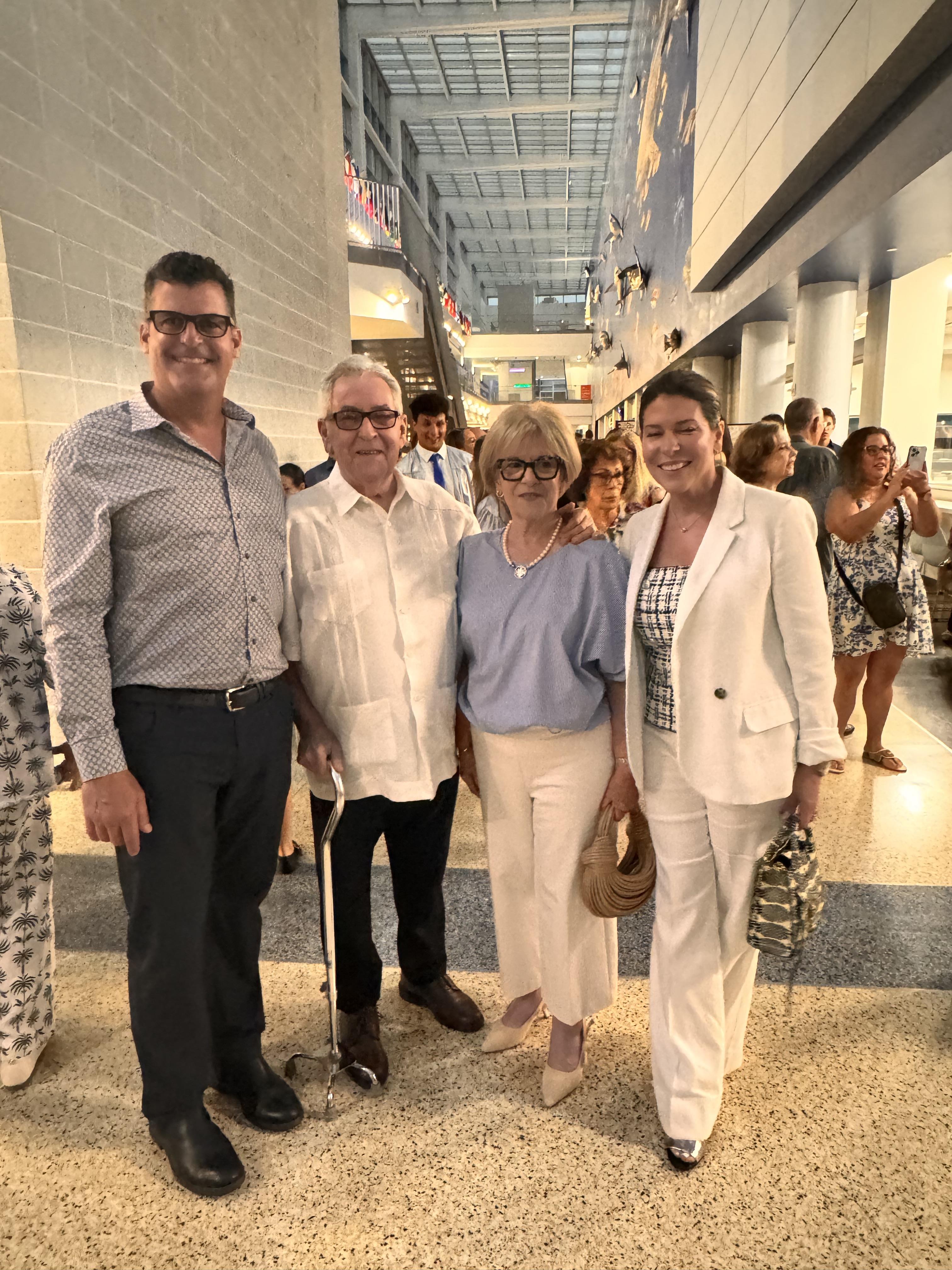 A group of people standing together in a hallway