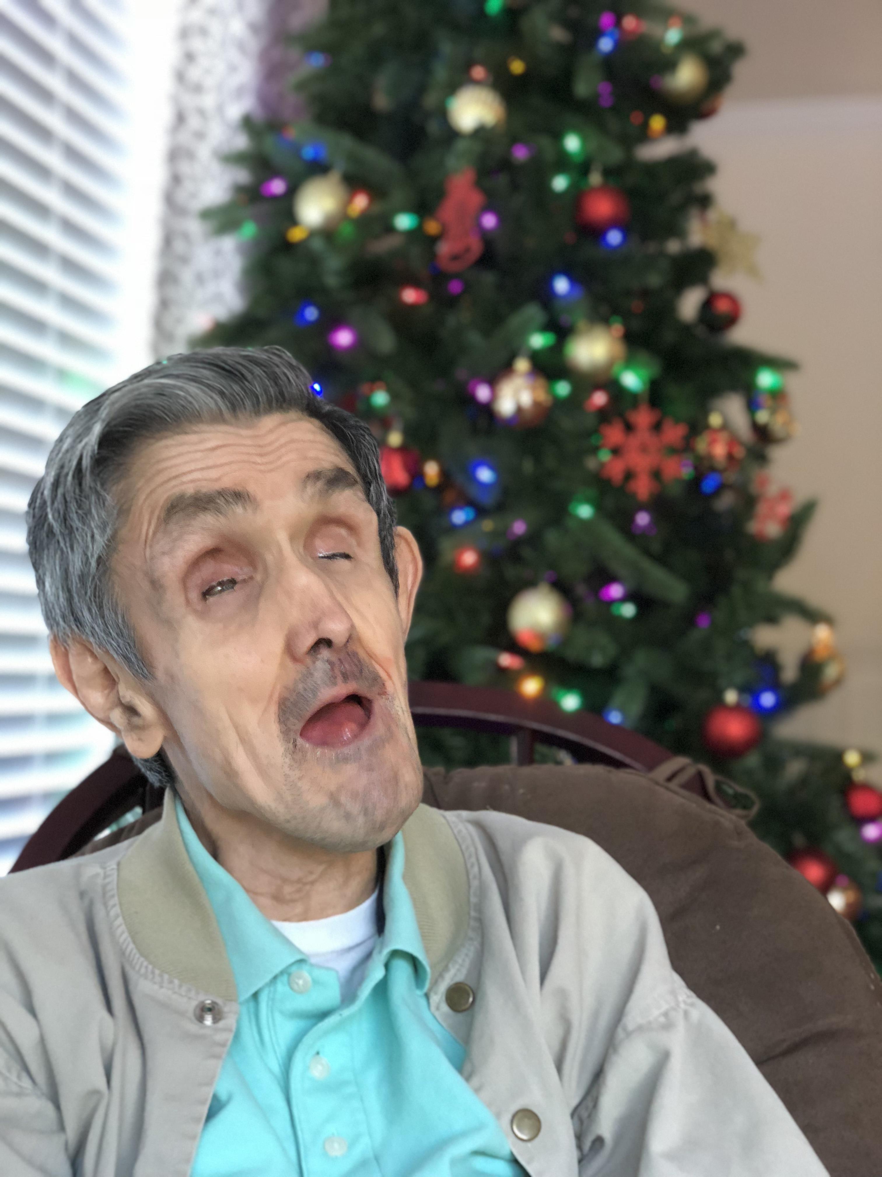 A man with his eyes closed and mouth open