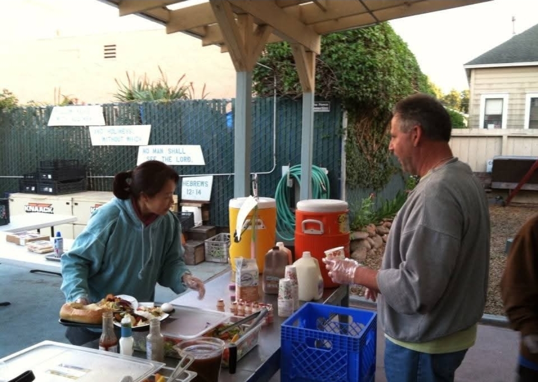 A man and woman standing at a table