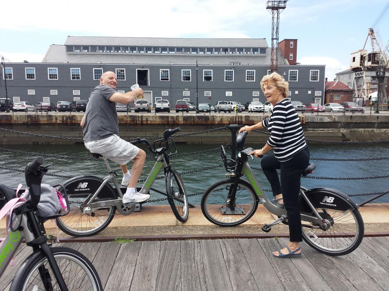 A man and woman on bicycles