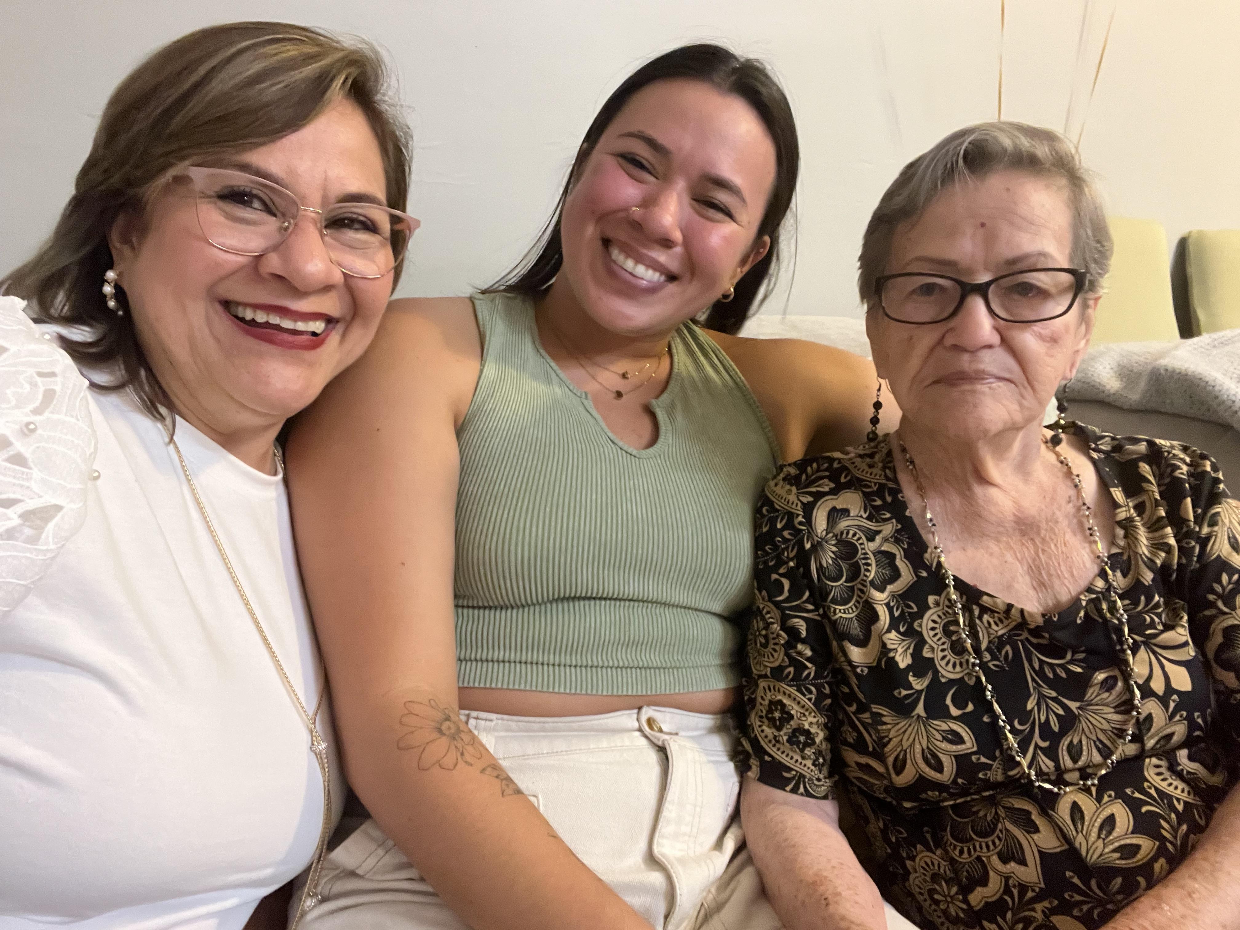 A group of women sitting together smiling