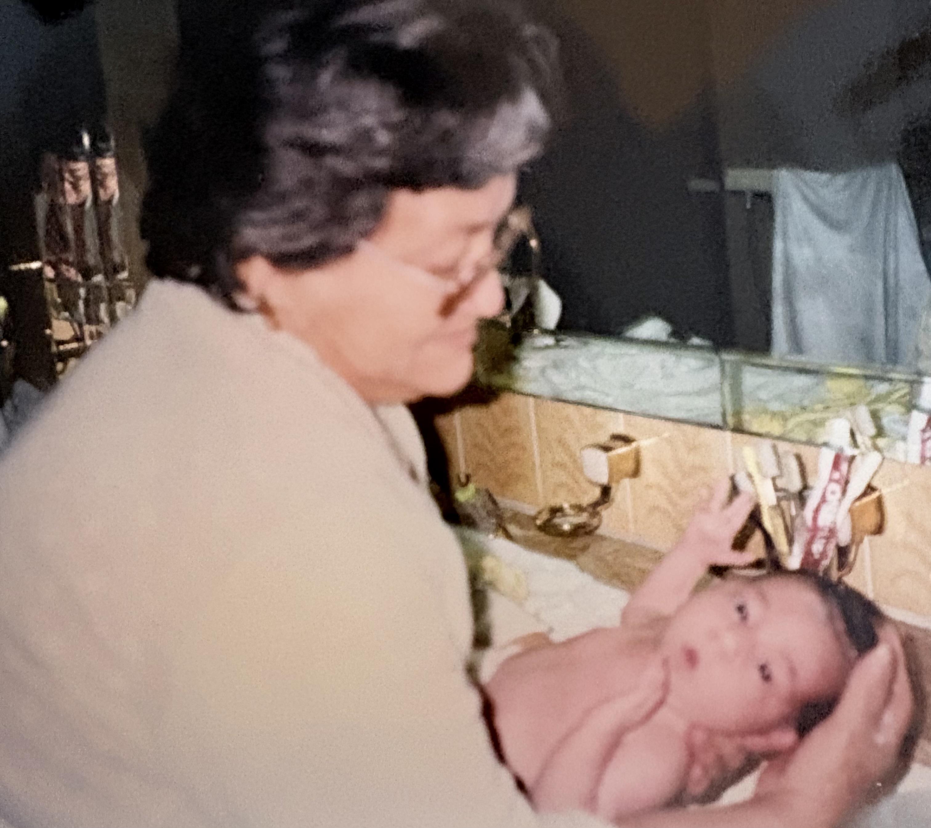A woman holding a baby