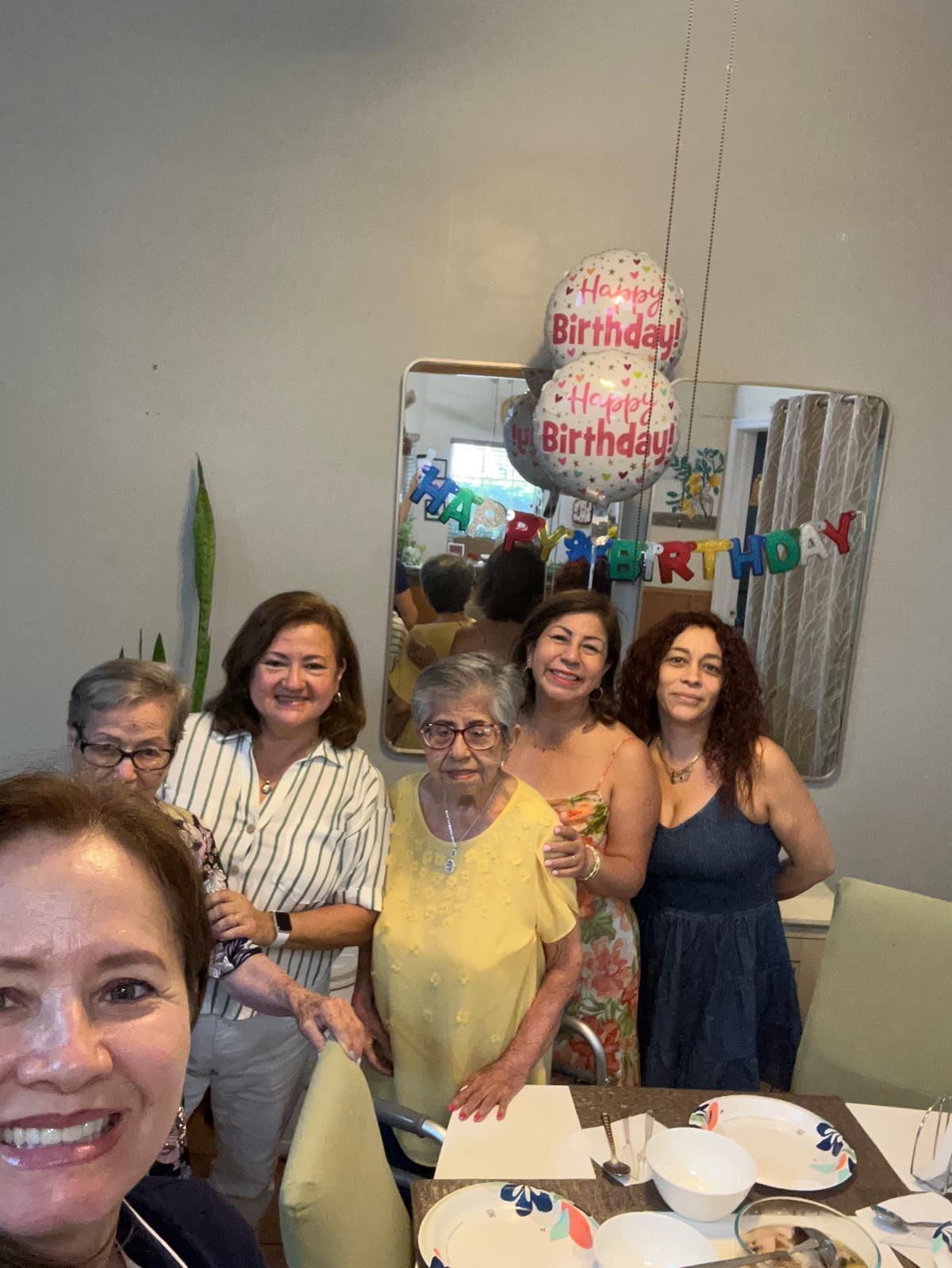 A group of women posing for a photo