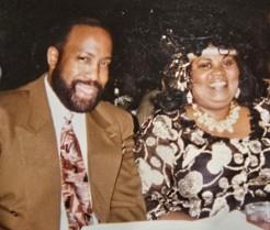 A man and woman smiling at camera