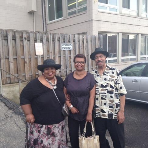 A group of people standing outside a building