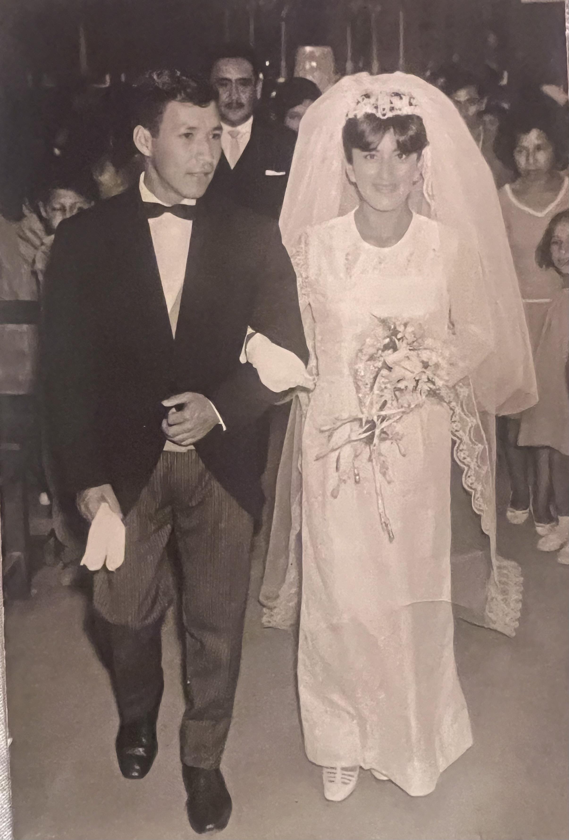 A man and woman in a wedding dress