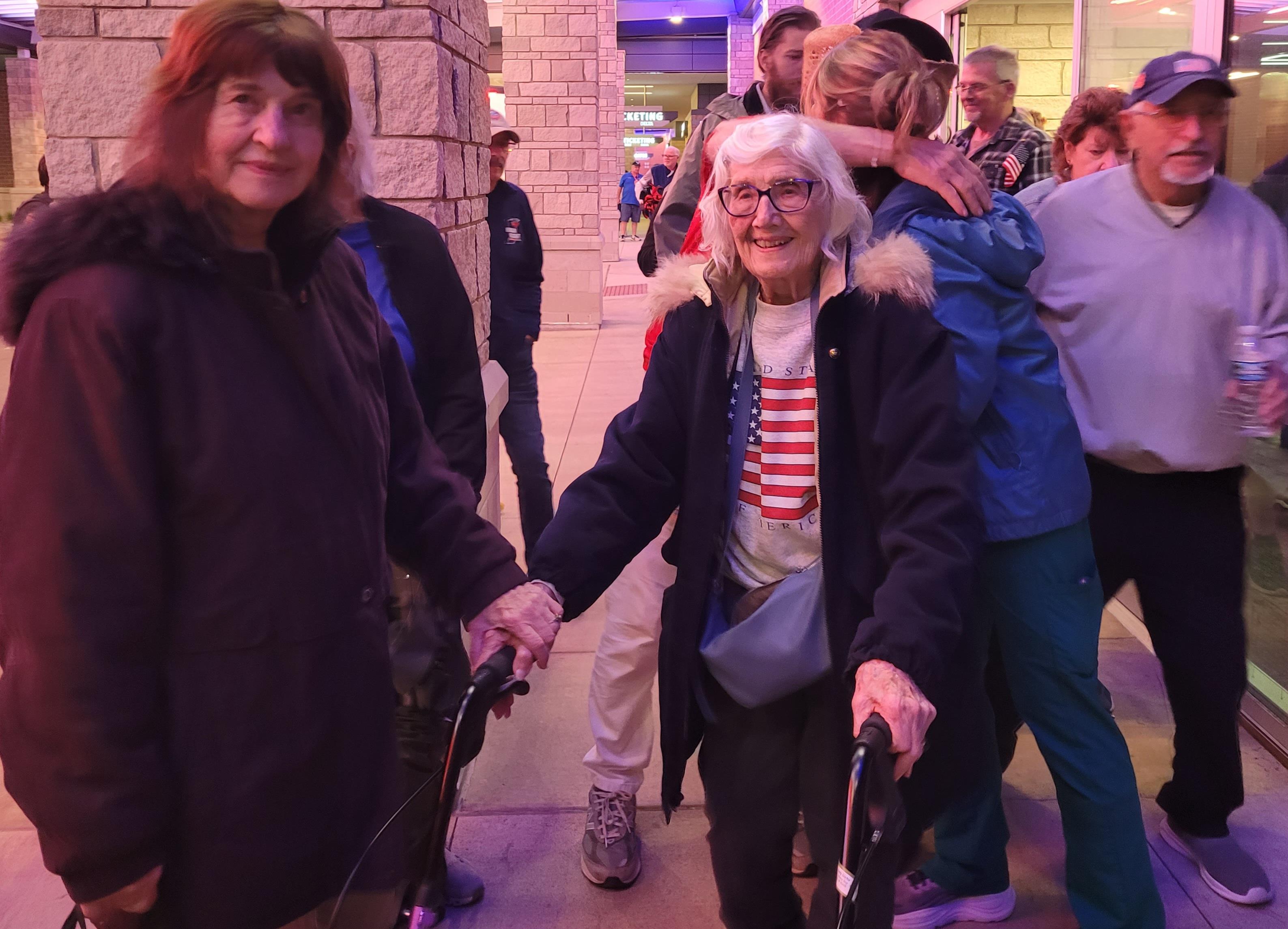 A group of people walking with a woman