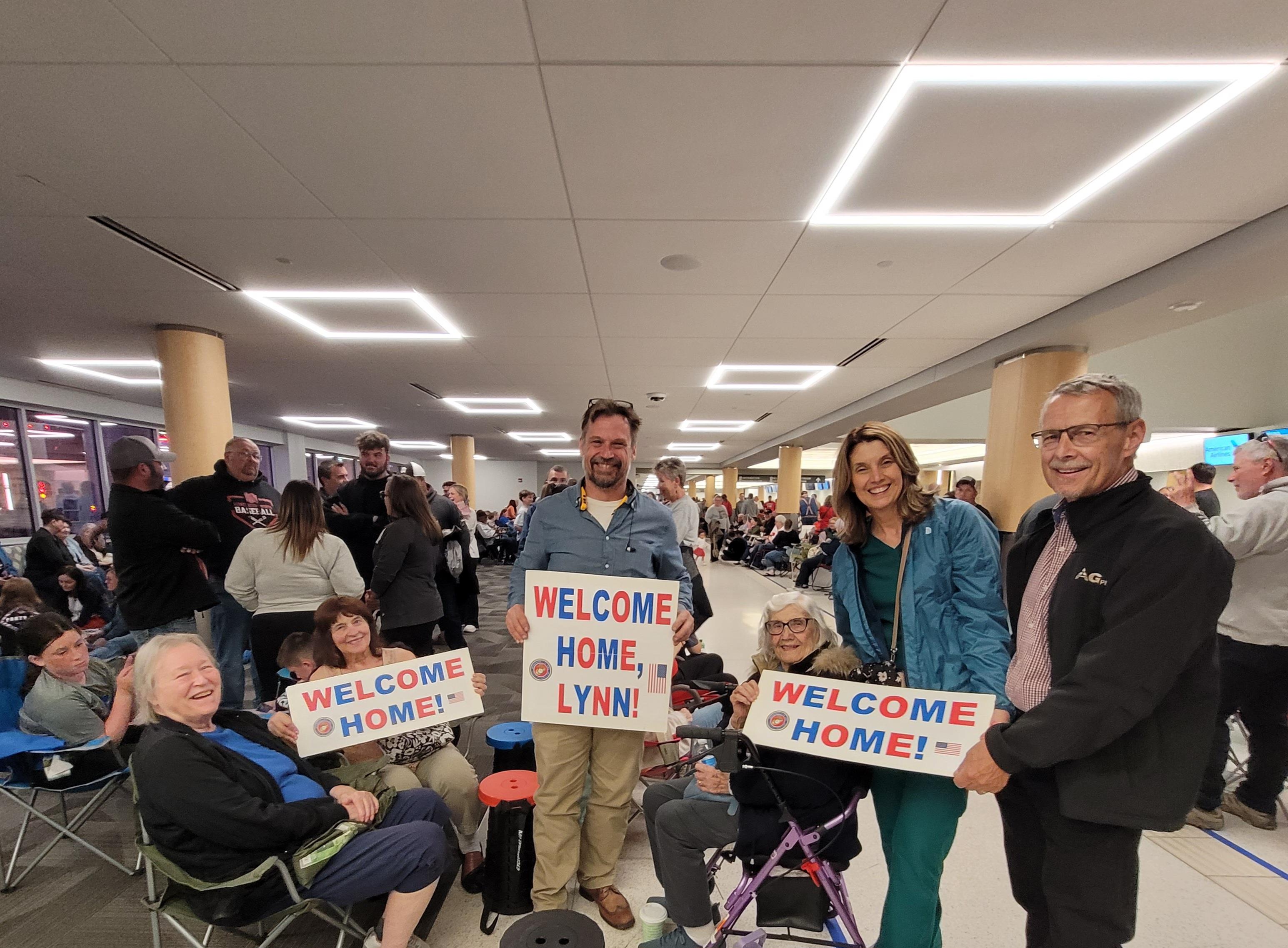 A group of people holding signs