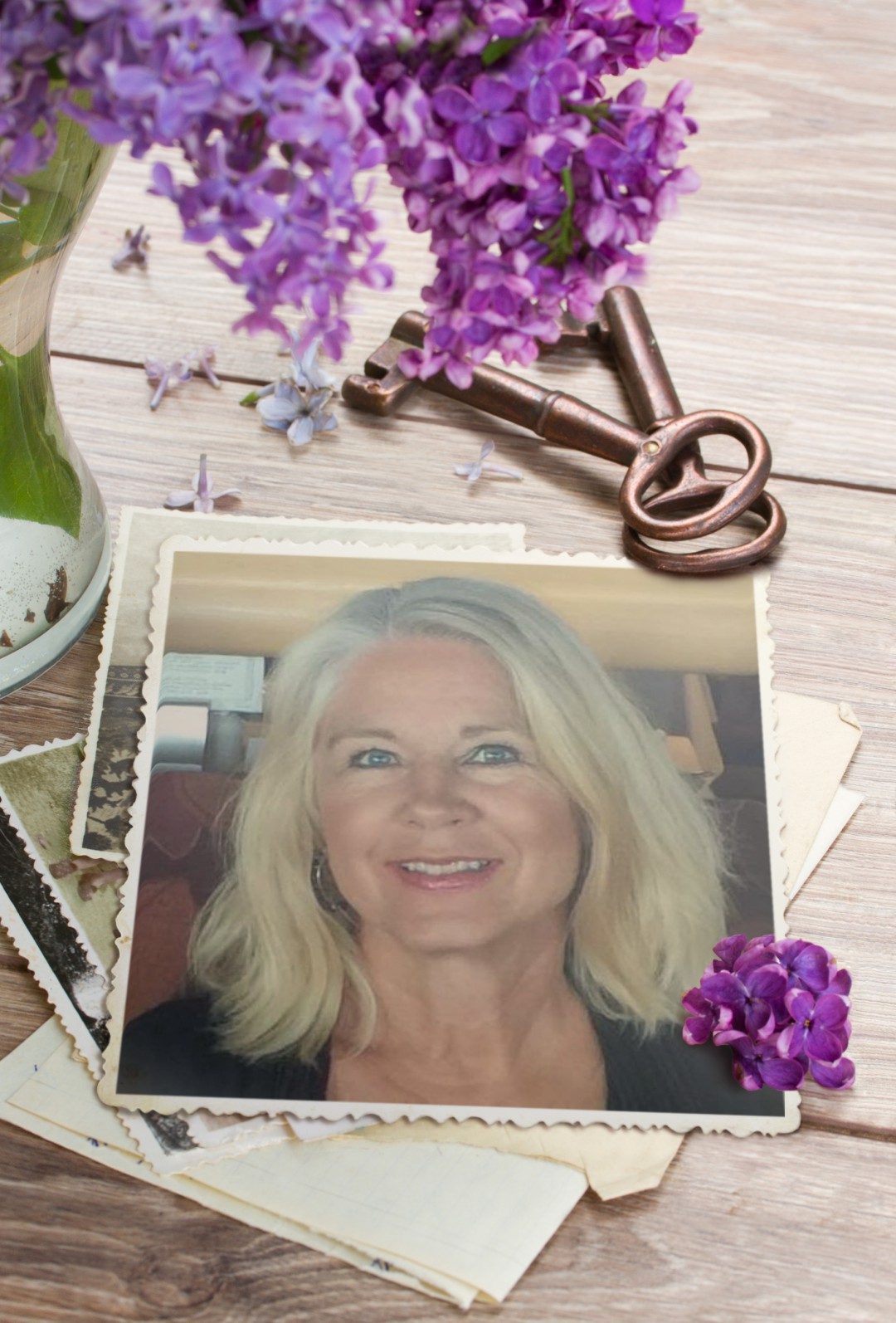 A woman with blonde hair and a bunch of purple flowers
