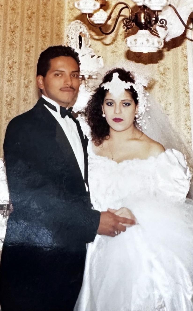 A man and woman in wedding attire