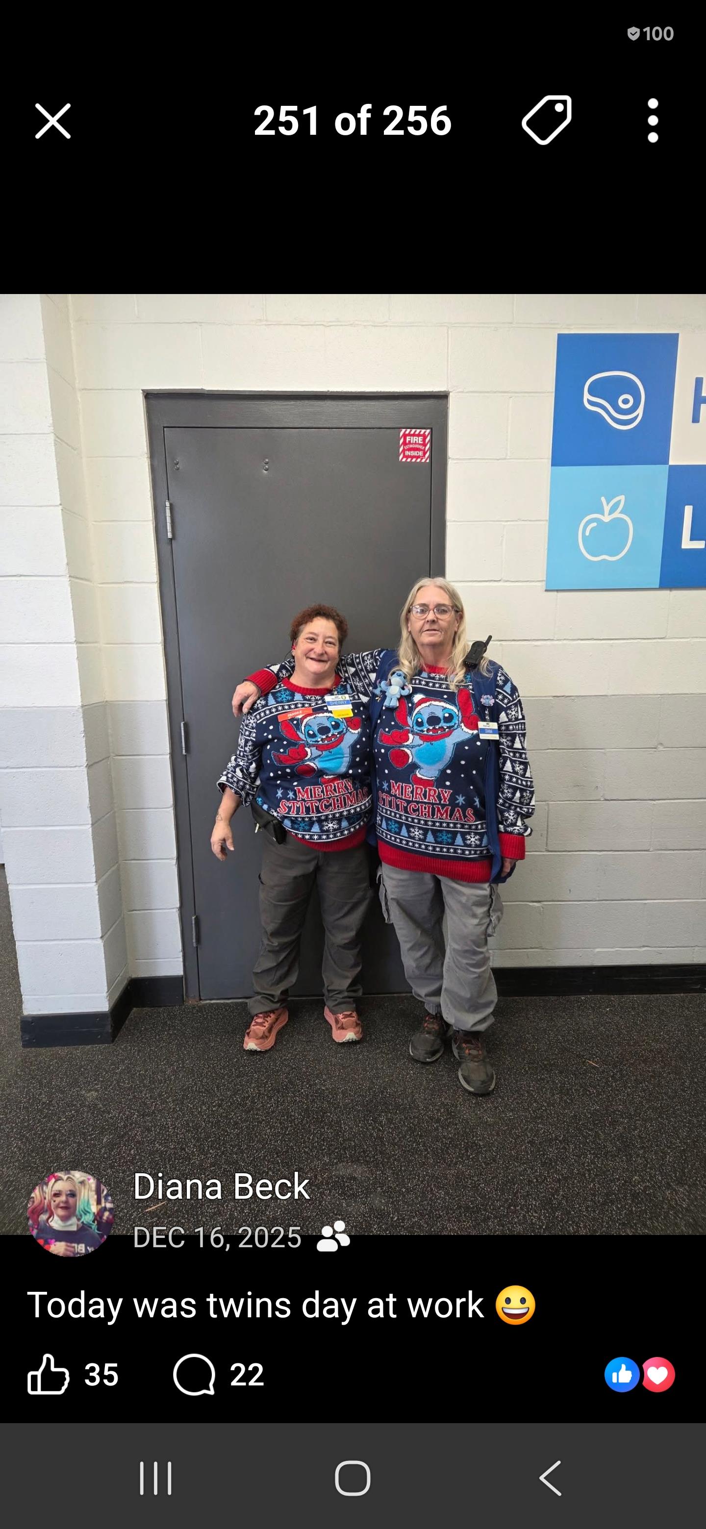 Two women standing in front of a door