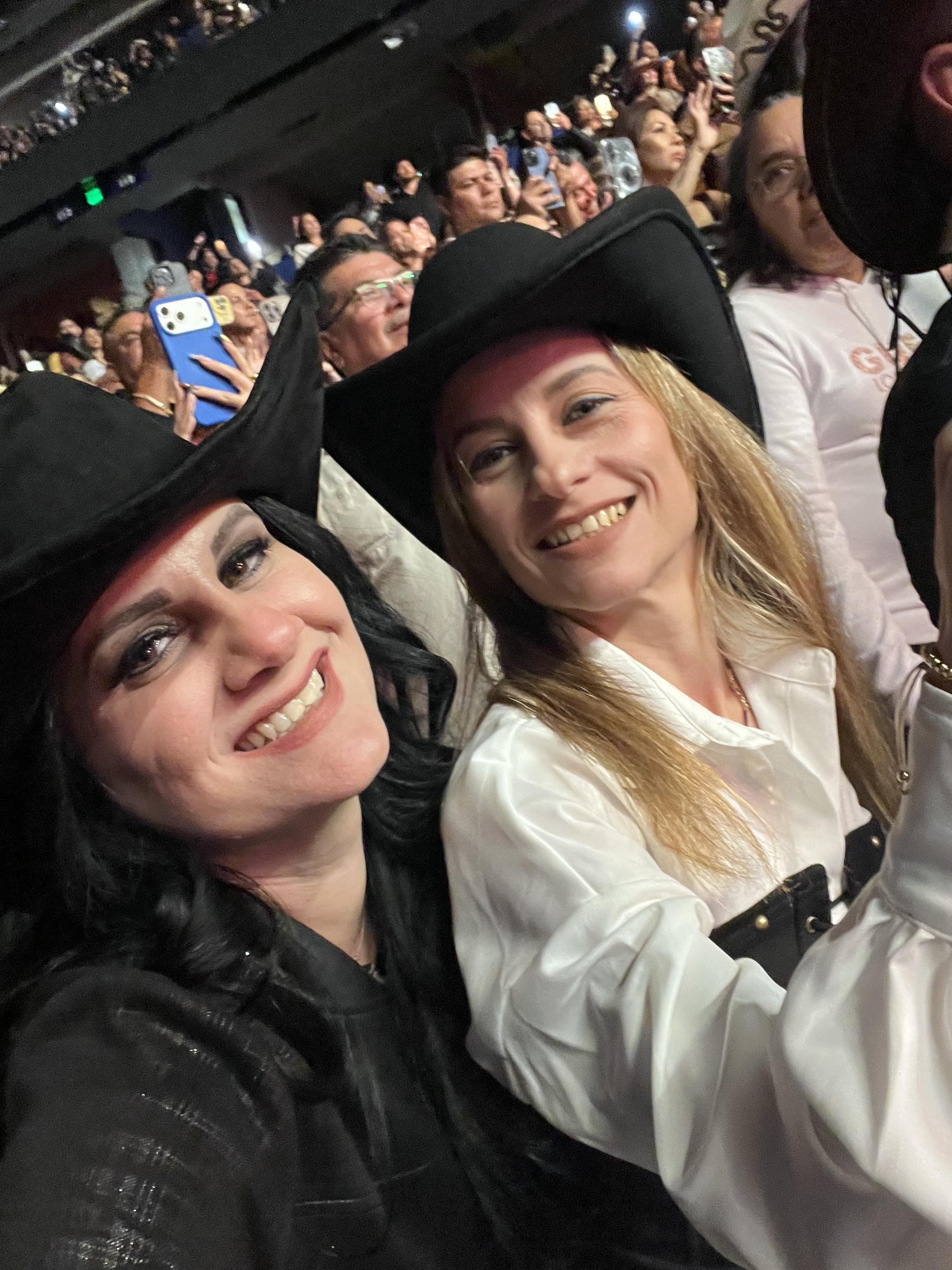 Two women in cowboy hats taking a selfie