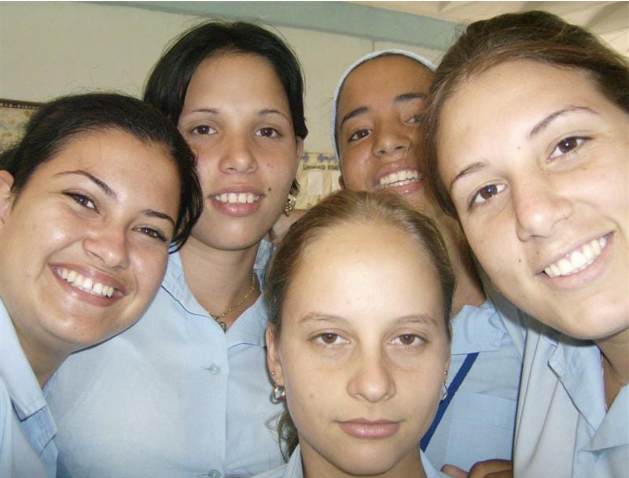 A group of young women smiling