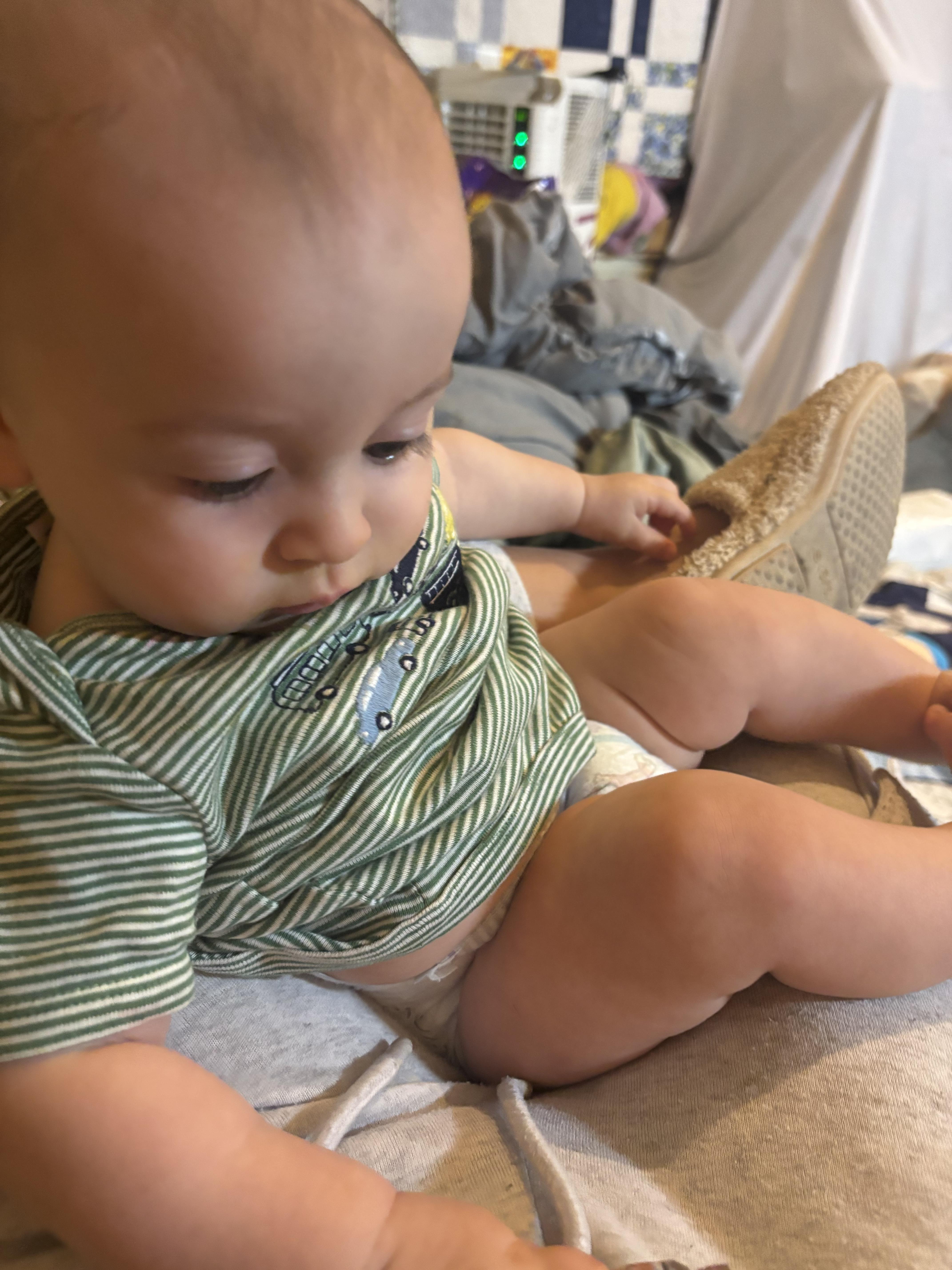A baby lying on a blanket