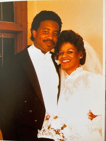 A man and woman posing for a picture