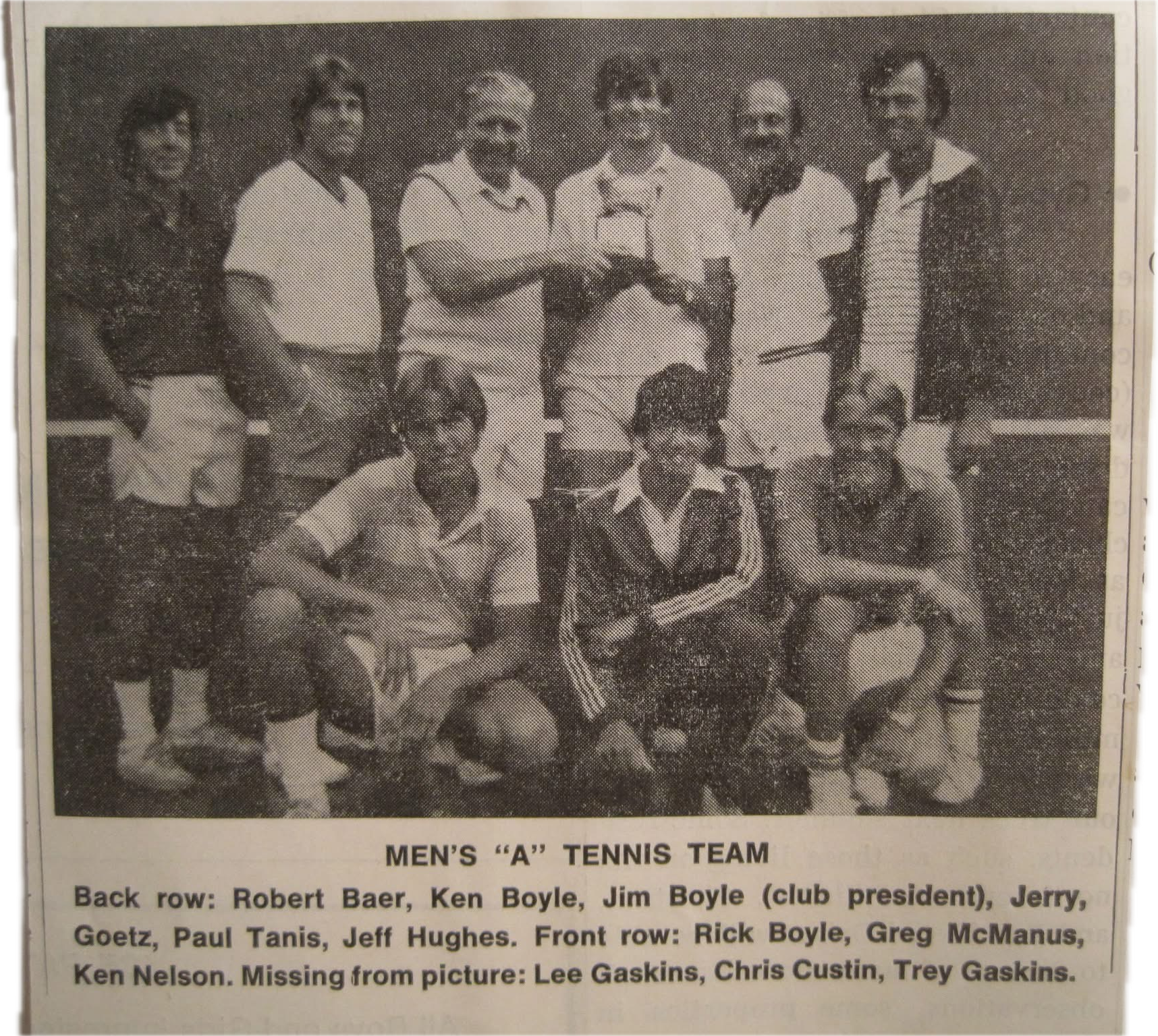 A group of men posing for a photo