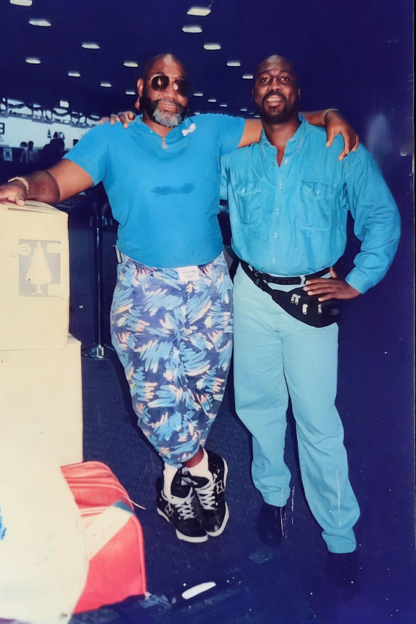 A couple of men posing for a picture