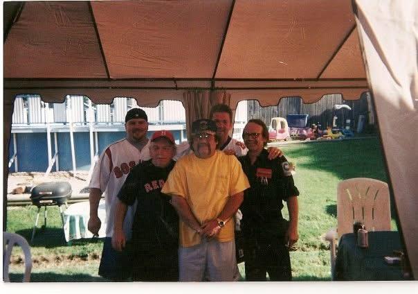 A group of people standing under a tent