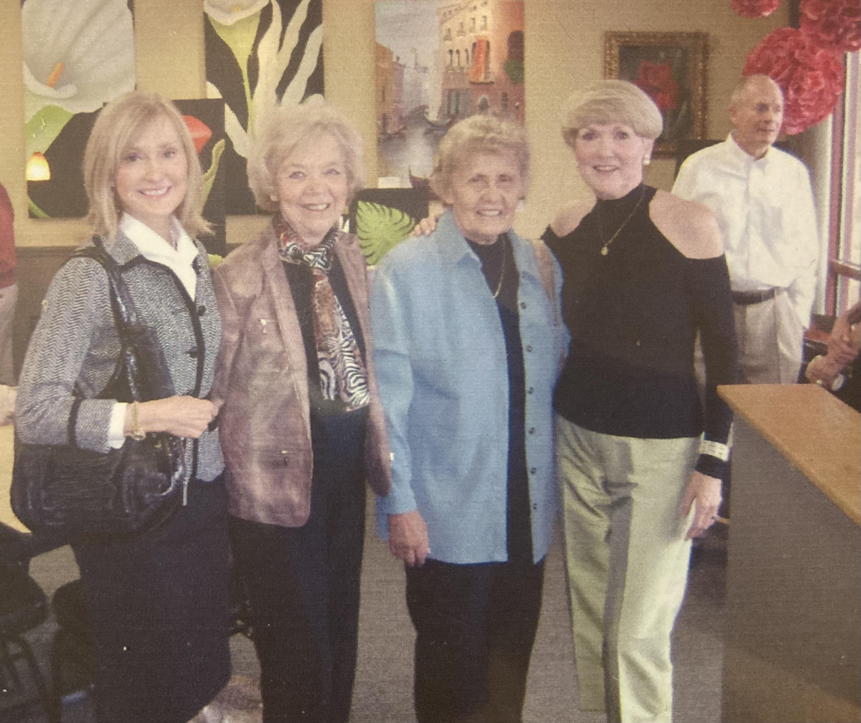 A group of women posing for a photo