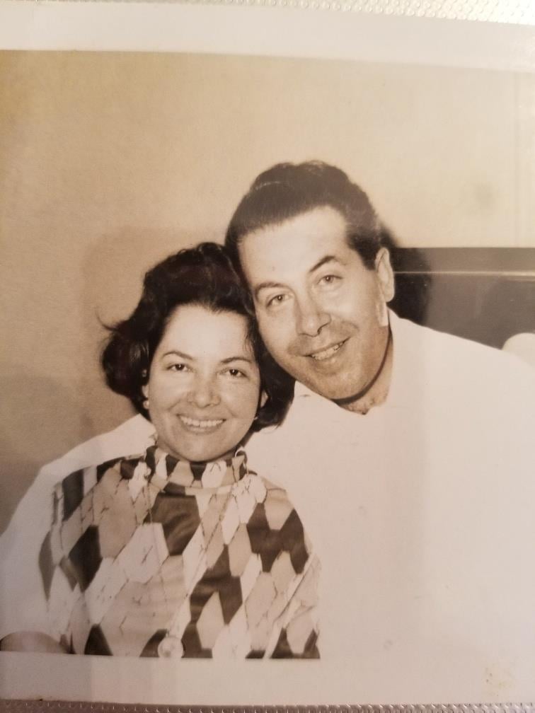 A man and woman posing for a picture