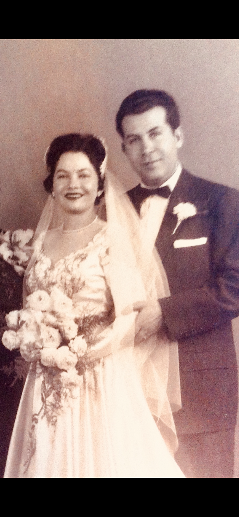 A man and woman posing for a picture