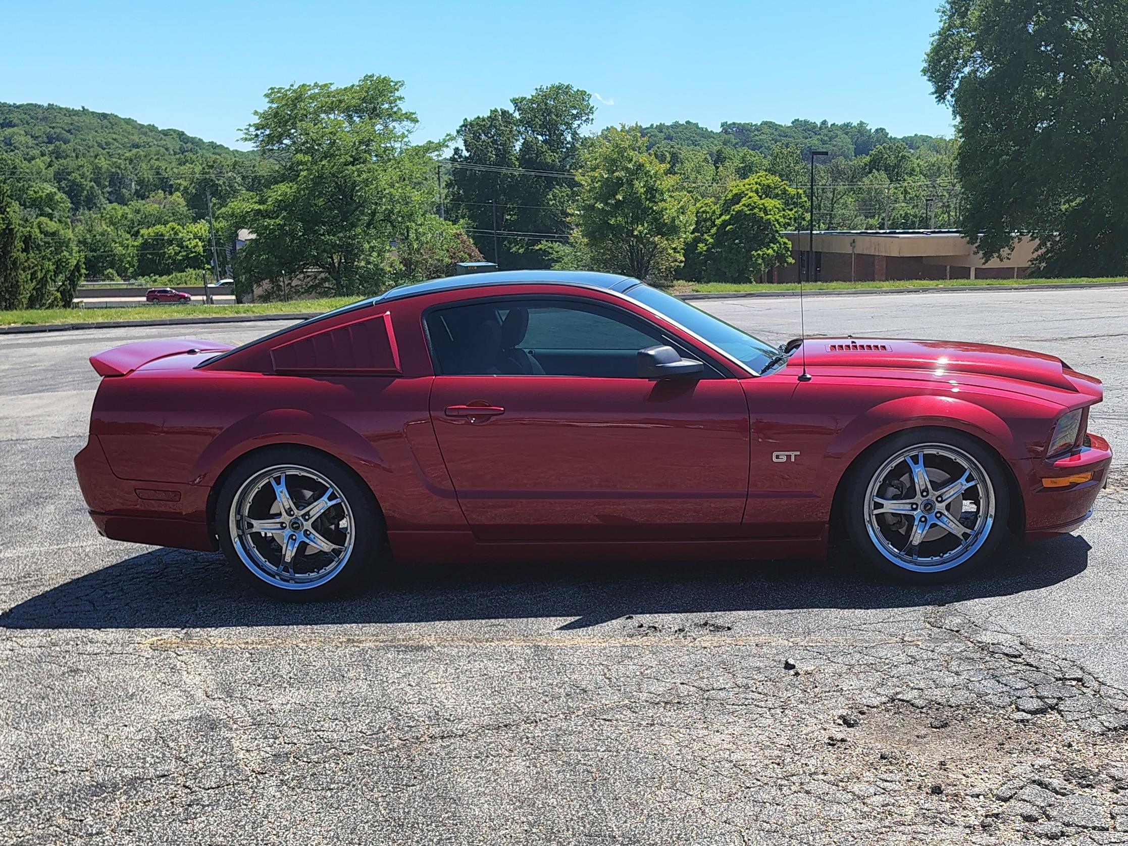 A red car parked on a road