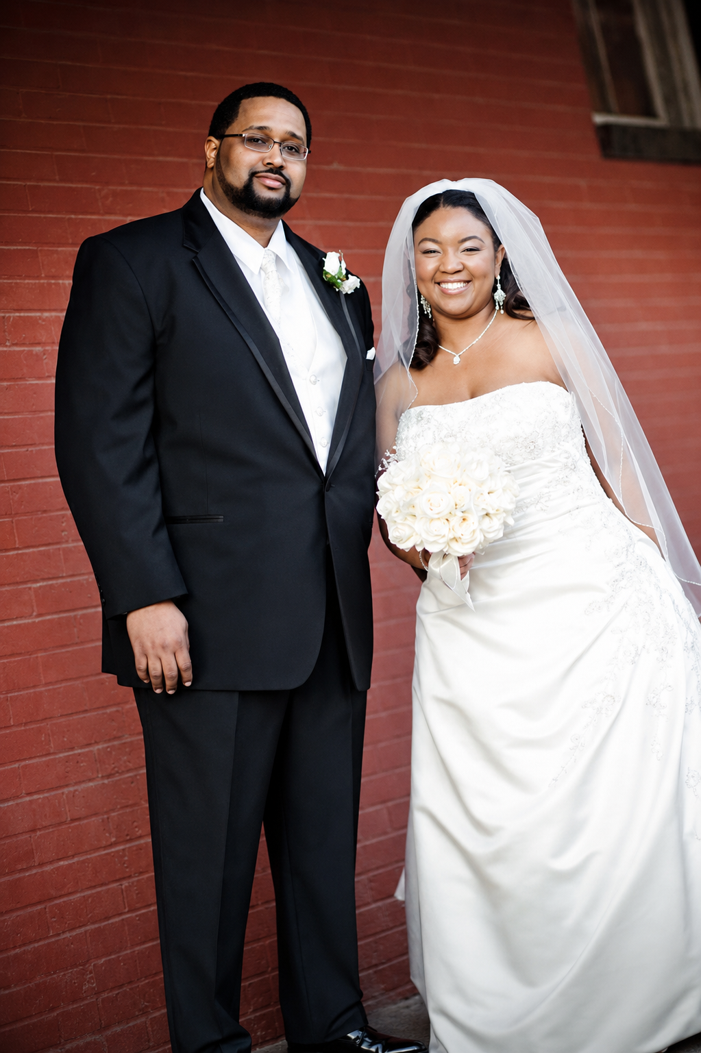 A man and woman posing for a picture