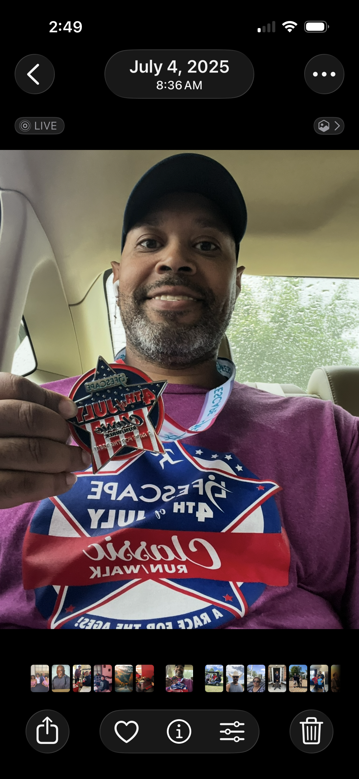 A man holding a medal