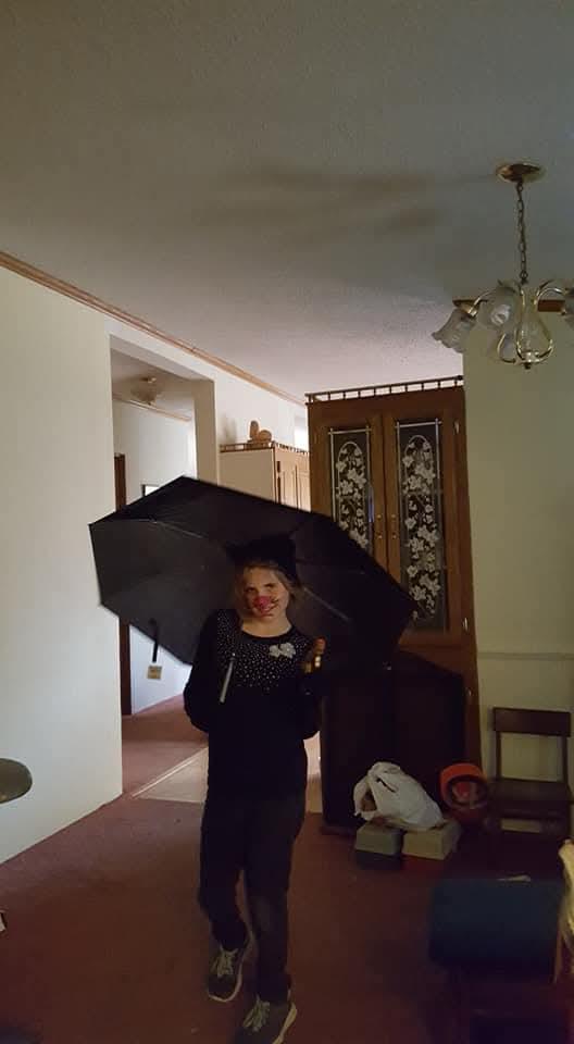 A woman holding an umbrella