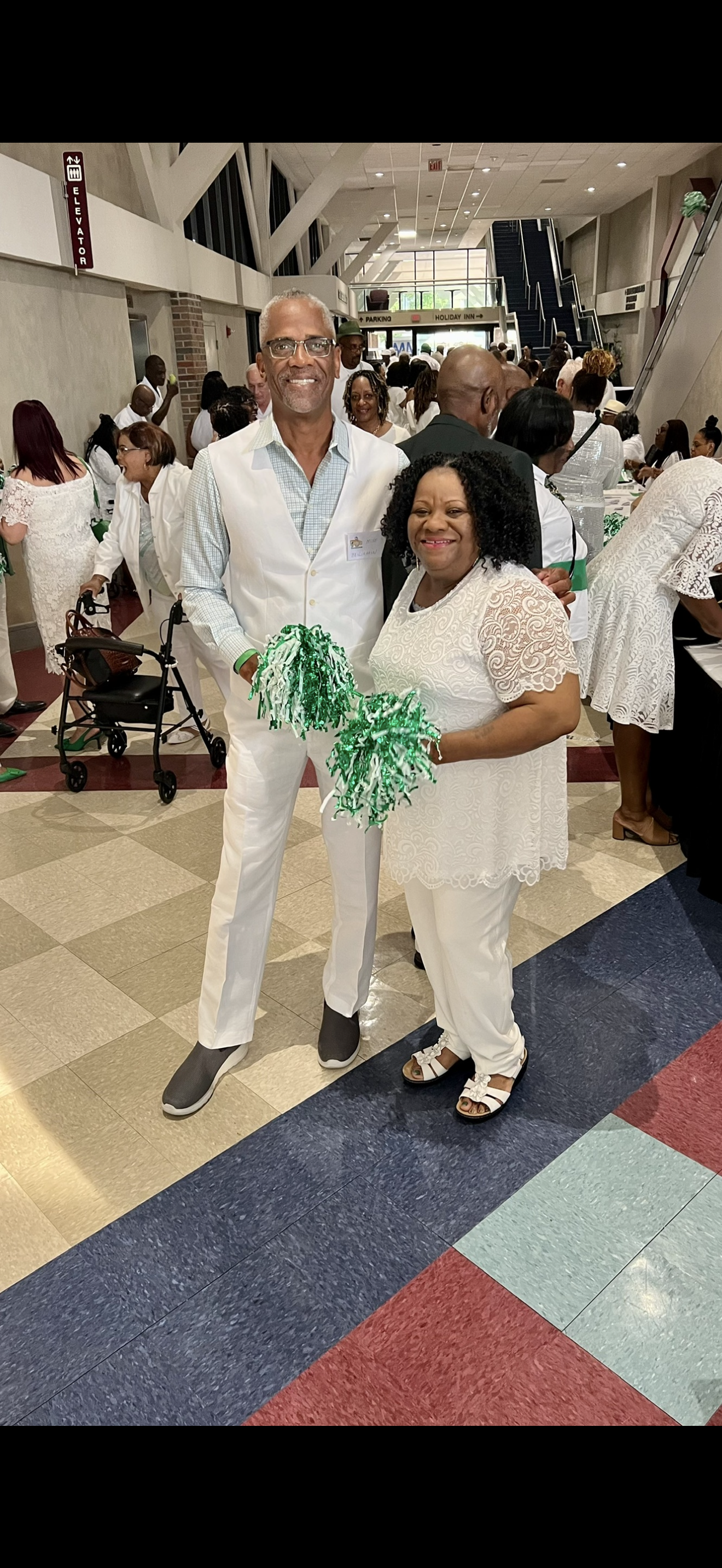 A man and woman in white outfits