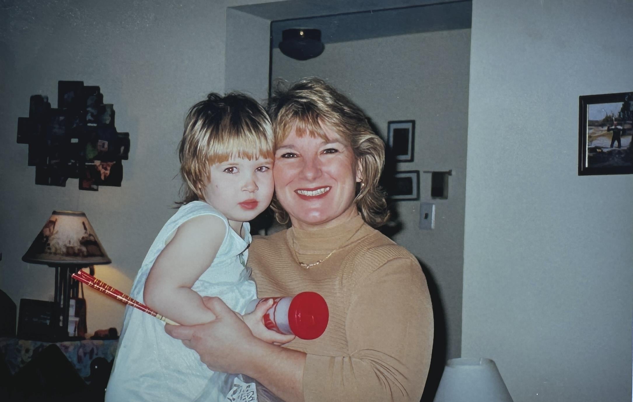 A woman holding a child