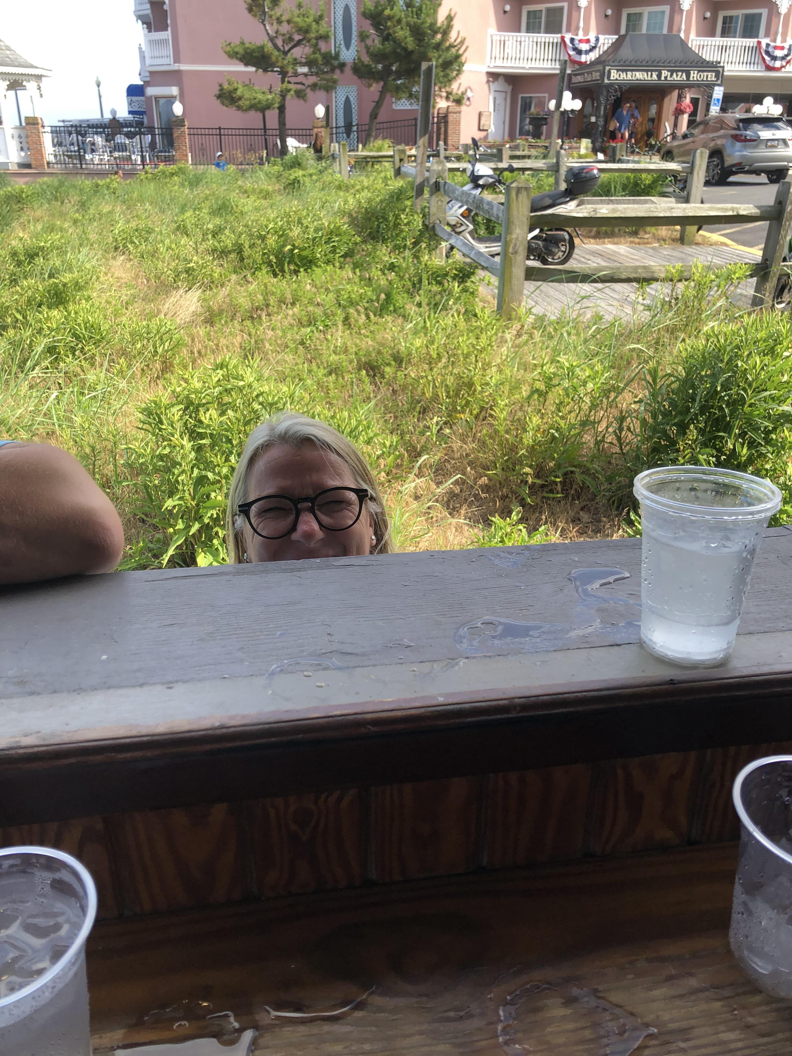 A person sitting behind a window ledge