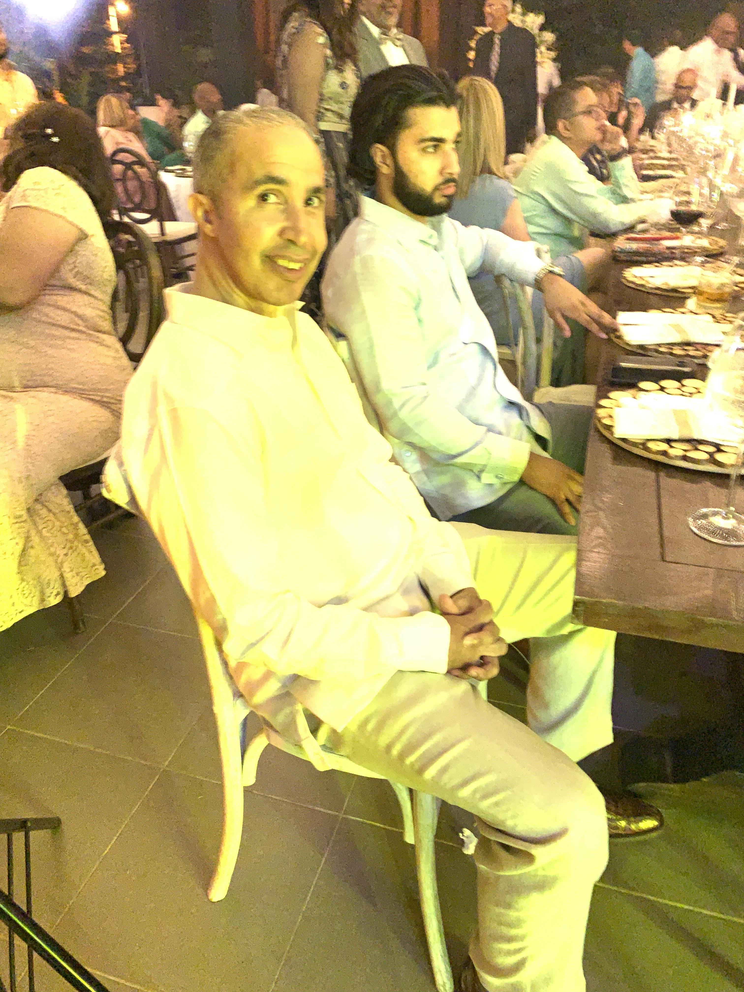A group of people sitting at a table