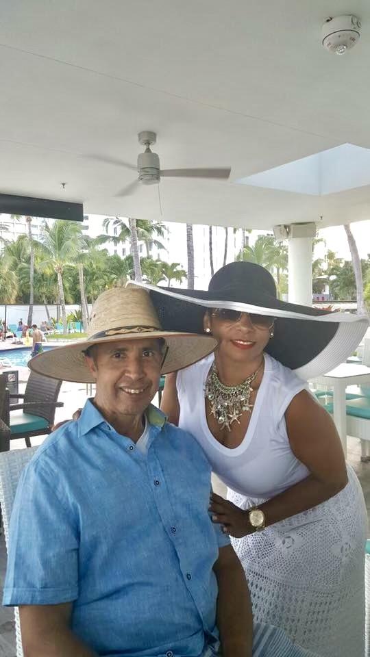 A man and woman wearing hats